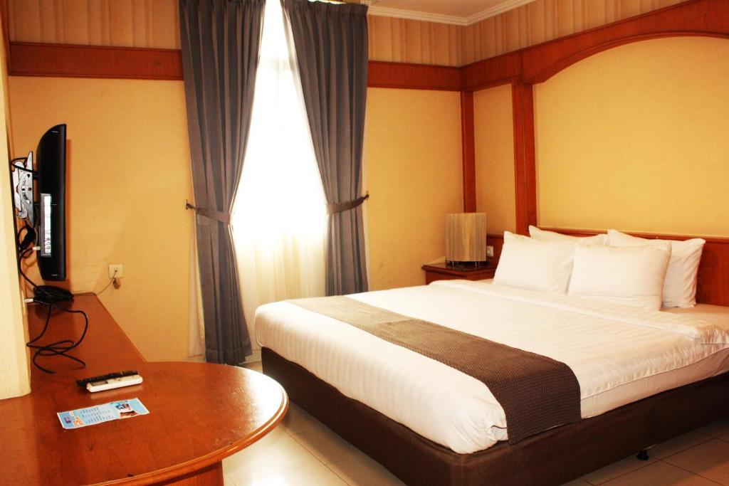 Travellers Suites Serviced Apartments Medan Bilik gambar